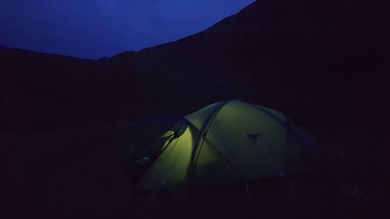 tent and mountains at dusk