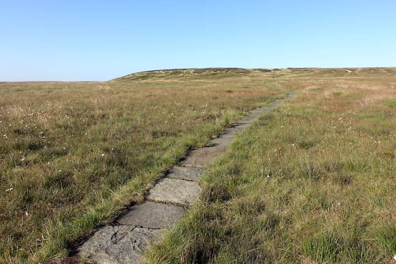 Paved narrow path leading up towards the Black Hill summit